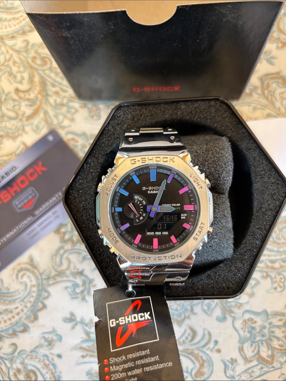G shock NWT black face steel band  blue and pink accents